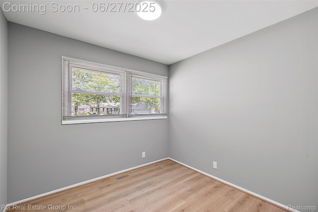 4550 Justine St, Shelby Twp, MI 48317 - empty room featuring wood finished floors and baseboards