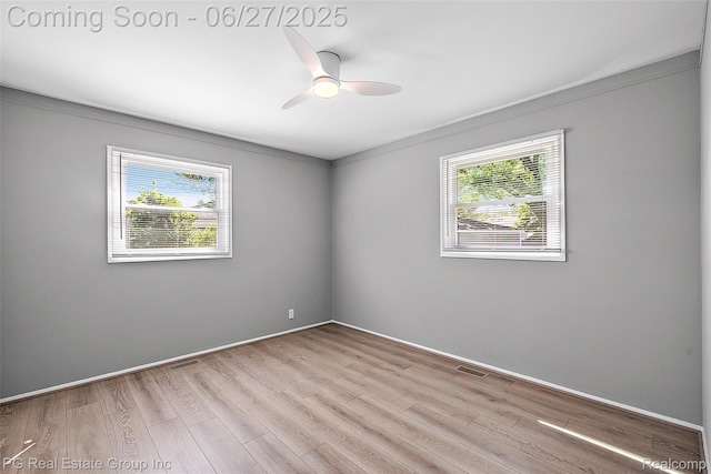 4550 Justine St, Shelby Twp, MI 48317 - spare room featuring wood finished floors and a ceiling fan