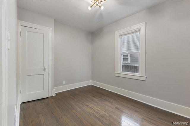 192 W Hopkins Ave, West Bloomfield, MI 48340 - empty room featuring baseboards and dark wood-style flooring