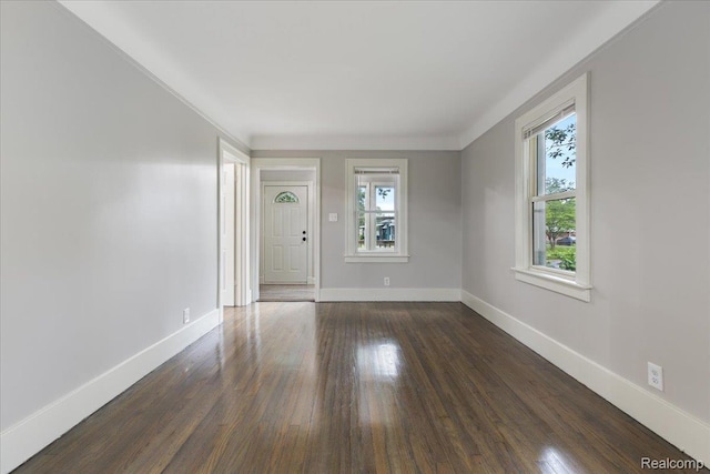 192 W Hopkins Ave, West Bloomfield, MI 48340 - spare room with plenty of natural light, dark wood finished floors, and crown molding