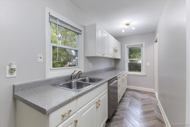 192 W Hopkins Ave, West Bloomfield, MI 48340 - kitchen with dishwasher, white cabinetry, and light countertops