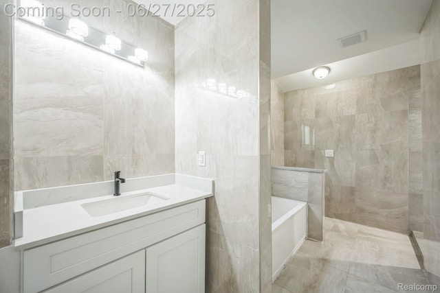 1730 E Woodruff Ave, Hazel Park, MI 48030 - full bathroom with tile walls, a garden tub, vanity, and walk in shower
