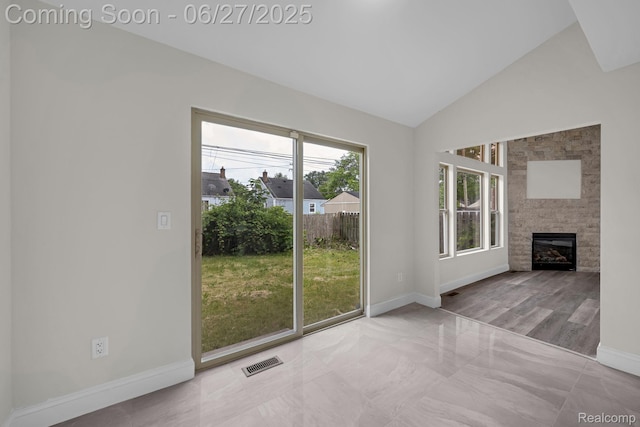 1730 E Woodruff Ave, Hazel Park, MI 48030 - unfurnished living room with a fireplace, marble finish flooring, and high vaulted ceiling