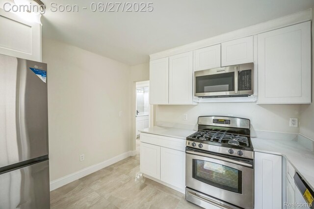 1730 E Woodruff Ave, Hazel Park, MI 48030 - kitchen featuring appliances with stainless steel finishes, light countertops, and white cabinets