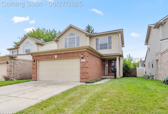 1730 E Woodruff Ave, Hazel Park, MI 48030 - view of front of home with brick siding, driveway, and an attached garage