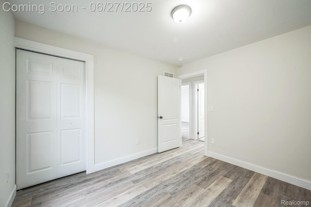 1730 E Woodruff Ave, Hazel Park, MI 48030 - unfurnished bedroom with wood finished floors and a closet