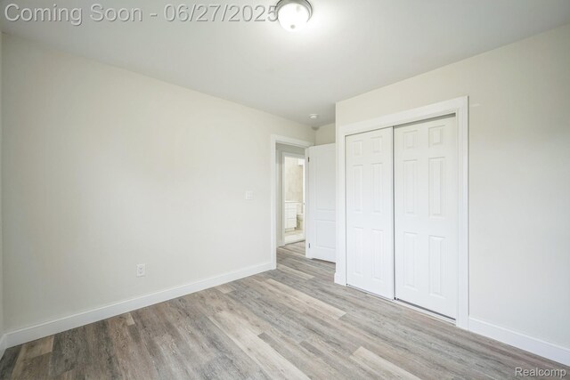 1730 E Woodruff Ave, Hazel Park, MI 48030 - unfurnished bedroom featuring wood finished floors and a closet