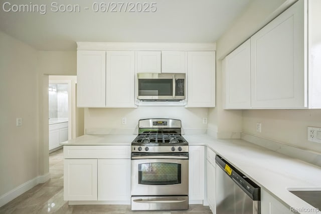1730 E Woodruff Ave, Hazel Park, MI 48030 - kitchen featuring appliances with stainless steel finishes, white cabinets, and light countertops