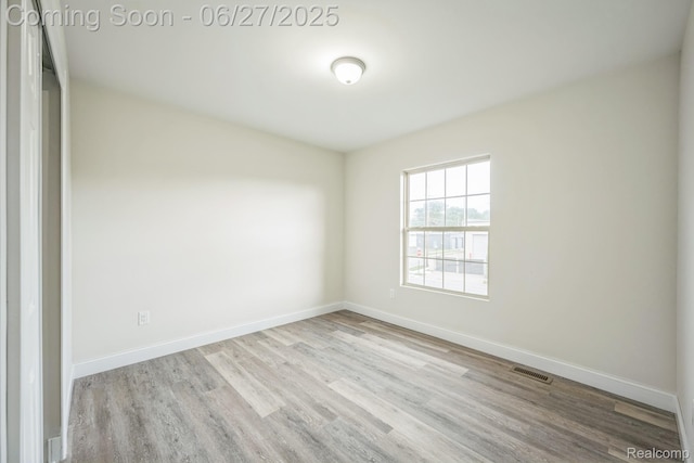 1730 E Woodruff Ave, Hazel Park, MI 48030 - spare room featuring wood finished floors and baseboards