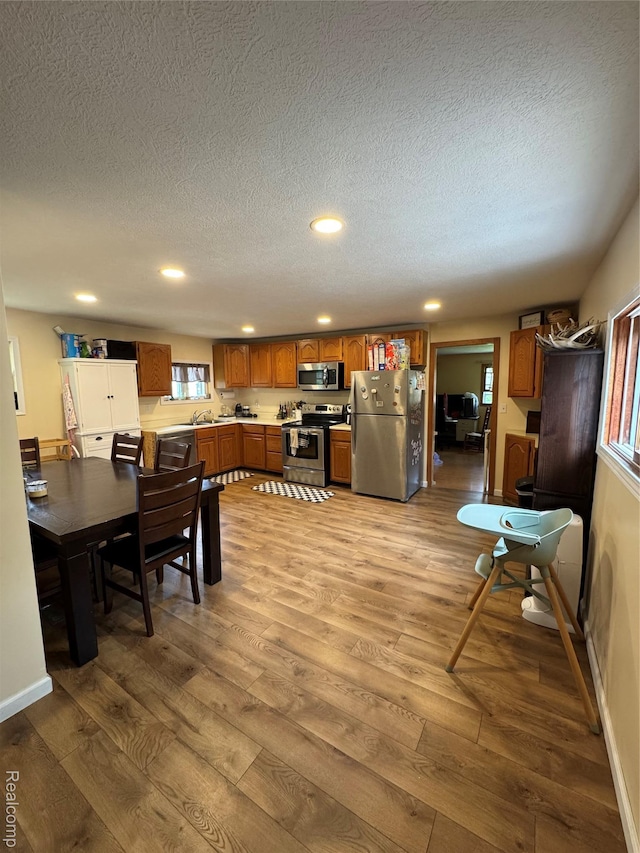 338 Green, Perry, MI 48872 - dining area featuring wood finished floors, recessed lighting, and a textured ceiling