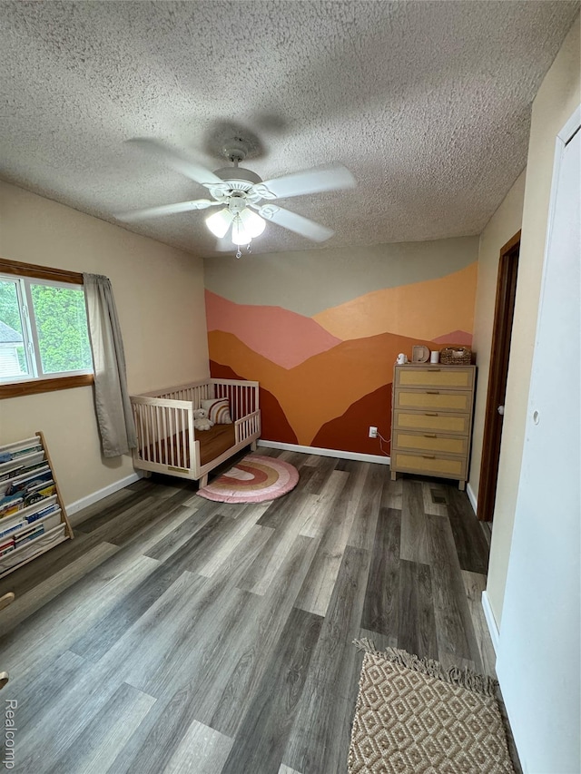 338 Green, Perry, MI 48872 - unfurnished bedroom with wood finished floors, a textured ceiling, ceiling fan, and lofted ceiling