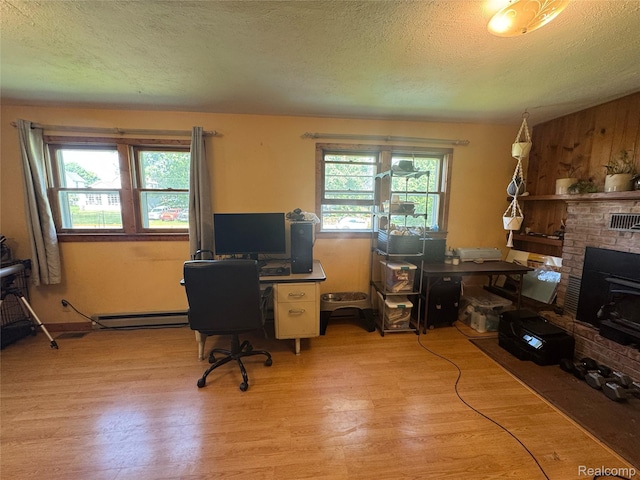 338 Green, Perry, MI 48872 - office space with light wood finished floors, a textured ceiling, and baseboard heating