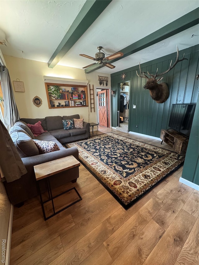 338 Green, Perry, MI 48872 - living room featuring wood finished floors, beam ceiling, and a ceiling fan