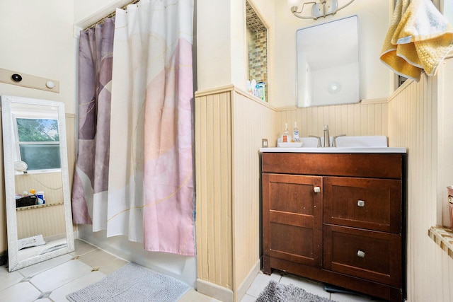 317 E Chart St, Plainwell, MI 49080 - full bath with a wainscoted wall, vanity, curtained shower, and tile patterned flooring