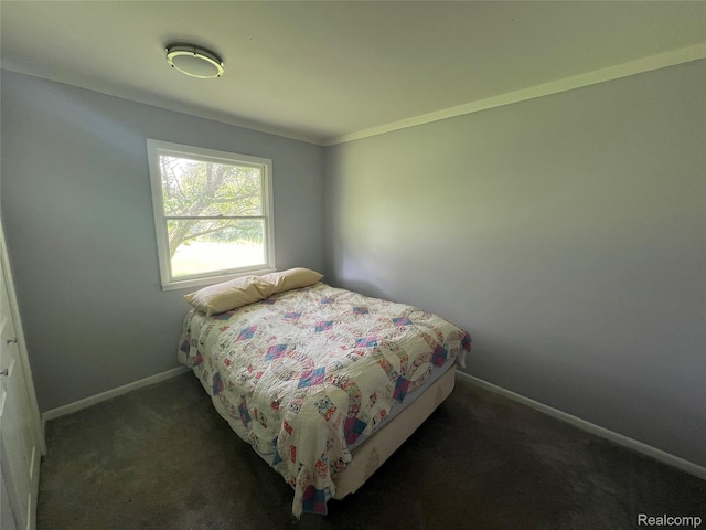 6197 Sober Rd, Fowlerville, MI 48836 - carpeted bedroom with baseboards