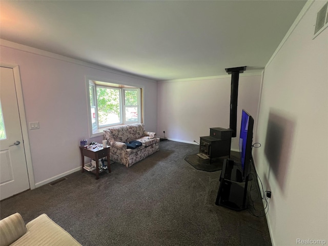 6197 Sober Rd, Fowlerville, MI 48836 - living area with a wood stove, dark carpet, and ornamental molding