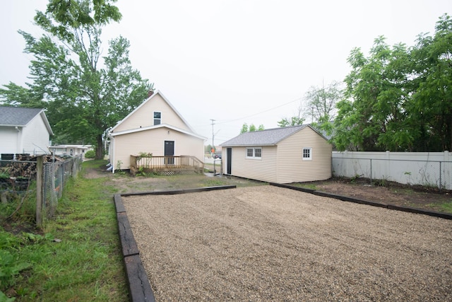 1100 W Laketon Ave, Muskegon, MI 49441 - back of house featuring an outbuilding and a deck