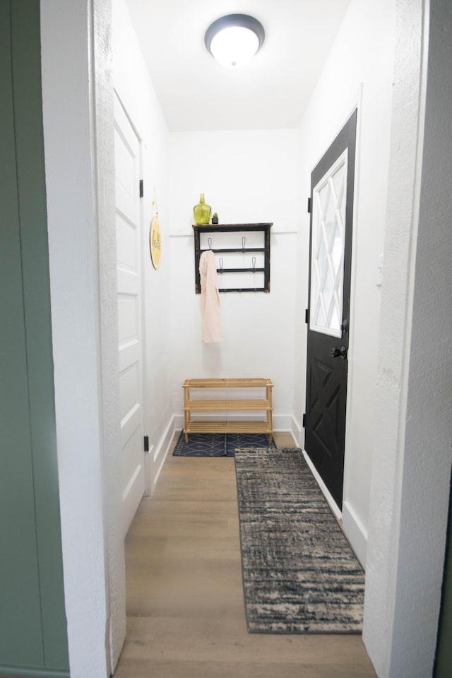 1100 W Laketon Ave, Muskegon, MI 49441 - hallway with wood finished floors and baseboards
