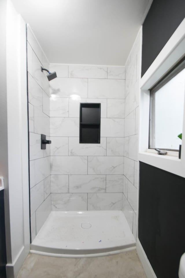 1100 W Laketon Ave, Muskegon, MI 49441 - bathroom featuring a tile shower