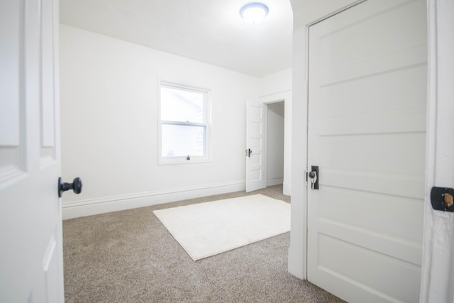 1100 W Laketon Ave, Muskegon, MI 49441 - unfurnished room featuring carpet flooring