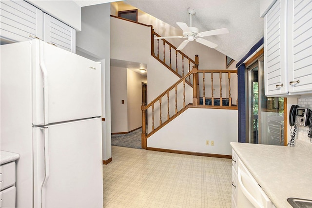 1769 Maple Ln, Benton Harbor, MI 49022 - kitchen featuring white appliances, a ceiling fan, white cabinetry, light countertops, and light carpet