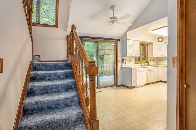 1769 Maple Ln, Benton Harbor, MI 49022 - stairway featuring lofted ceiling and a ceiling fan