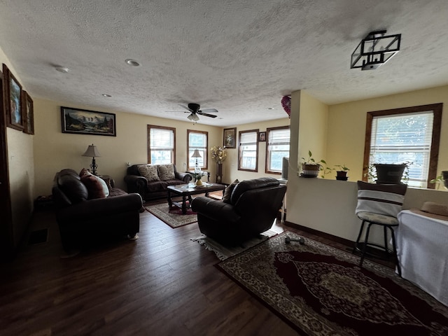 313 N Matteson St, Bronson, MI 49028 - living room with a textured ceiling, dark wood finished floors, and ceiling fan
