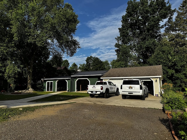 313 N Matteson St, Bronson, MI 49028 - view of front of home featuring driveway and a garage