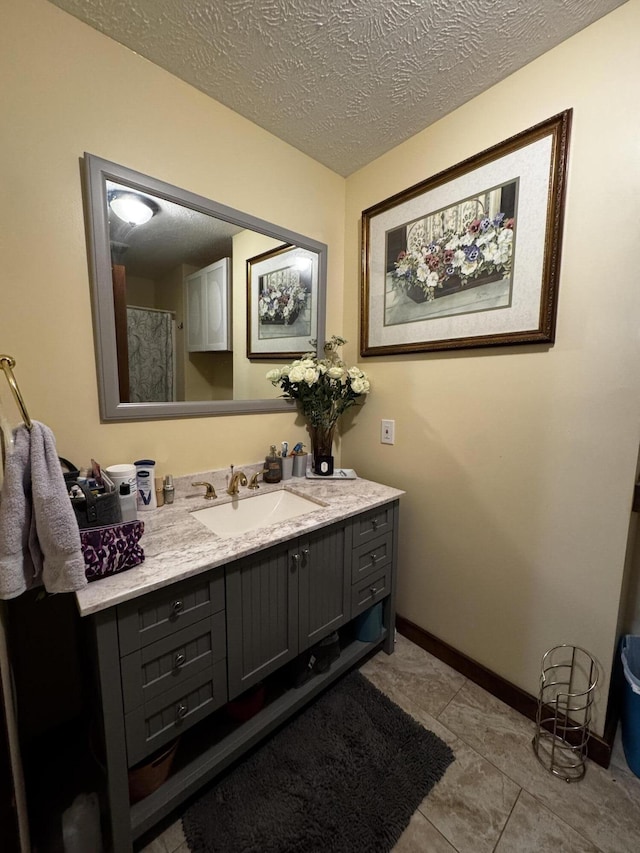 313 N Matteson St, Bronson, MI 49028 - bathroom with vanity and a textured ceiling