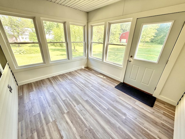 10844 Judd Rd, Willis, MI 48191 - unfurnished sunroom featuring wood finished floors