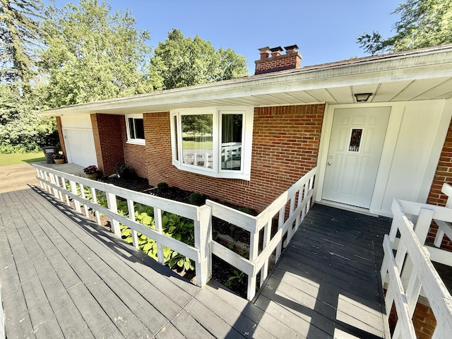 10844 Judd Rd, Willis, MI 48191 - wooden terrace featuring a garage