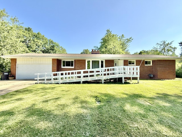 10844 Judd Rd, Willis, MI 48191 - ranch-style house featuring a garage, brick siding, a front yard, driveway, and a chimney
