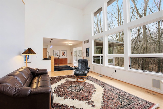 8023 Trail Rdg, Dexter, MI 48130 - living room with wood finished floors and a high ceiling