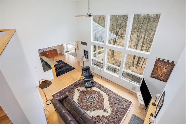 8023 Trail Rdg, Dexter, MI 48130 - living room featuring a high ceiling and wood finished floors