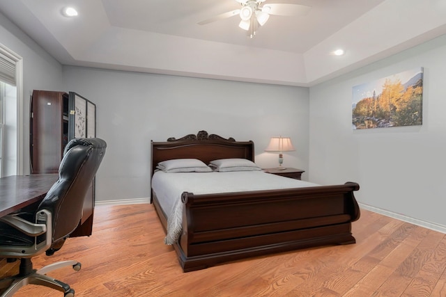 575 Autumns Way Blvd, Kalamazoo, MI 49009 - bedroom with a tray ceiling, light wood-type flooring, an office area, recessed lighting, and a ceiling fan