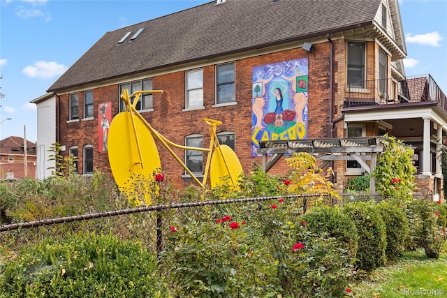 5216 Avery St, Detroit, MI 48208 - back of house featuring brick siding and roof with shingles