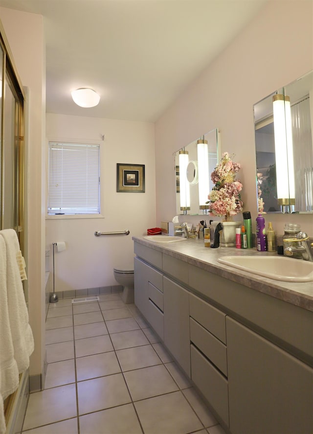 8141 N Elms Rd, Flushing, MI 48433 - full bath with double vanity and tile patterned floors