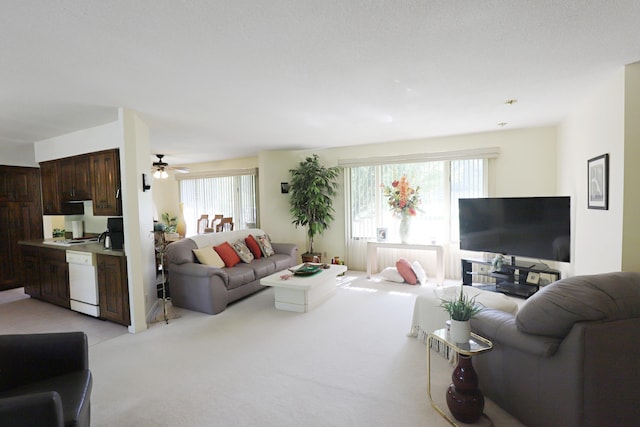 8141 N Elms Rd, Flushing, MI 48433 - living area featuring light carpet and ceiling fan