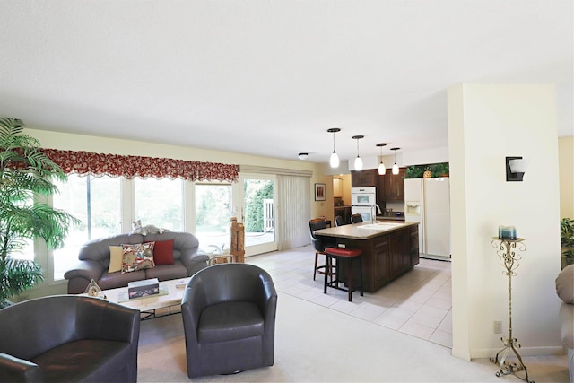 8141 N Elms Rd, Flushing, MI 48433 - living room with light tile patterned floors and light colored carpet