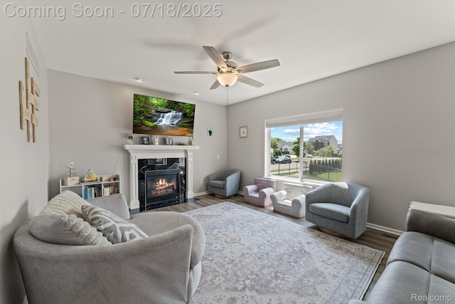 4074 Peach Tree Ln, Howell, MI 48843 - living room featuring wood finished floors, ceiling fan, and a fireplace