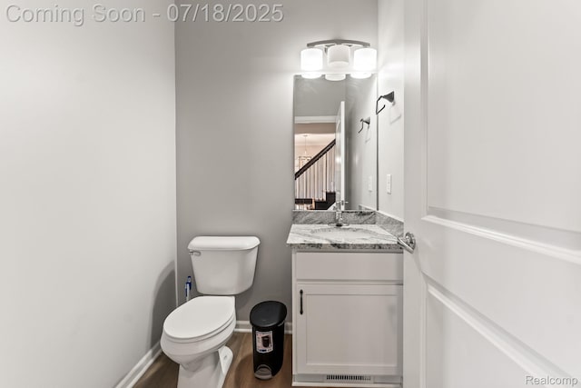 4074 Peach Tree Ln, Howell, MI 48843 - half bath featuring vanity and wood finished floors