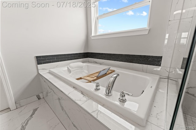 4074 Peach Tree Ln, Howell, MI 48843 - bathroom featuring a garden tub and marble look tile flooring