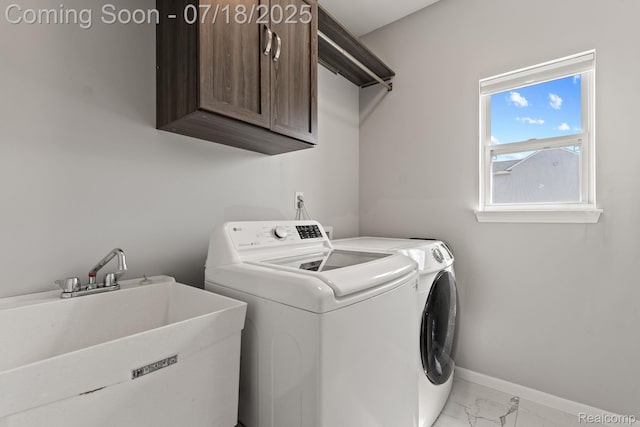 4074 Peach Tree Ln, Howell, MI 48843 - laundry room with cabinet space, marble finish flooring, and washing machine and dryer