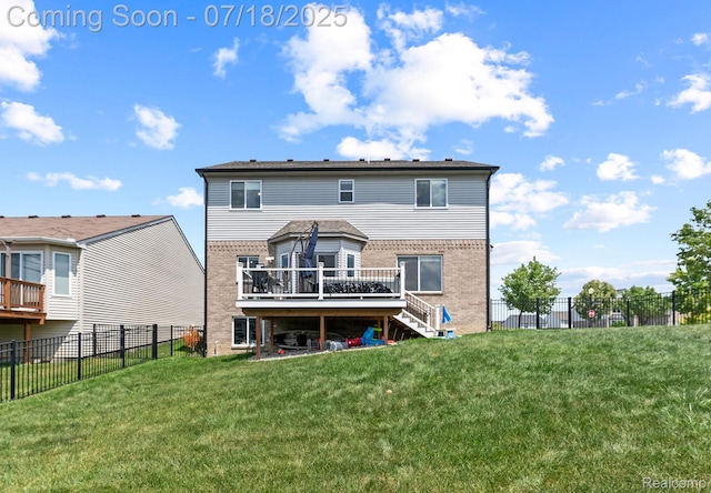 4074 Peach Tree Ln, Howell, MI 48843 - back of property featuring brick siding, stairway, a deck, and a fenced backyard