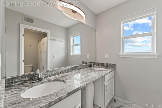 4074 Peach Tree Ln, Howell, MI 48843 - bathroom with marble look tile flooring and double vanity