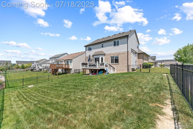 4074 Peach Tree Ln, Howell, MI 48843 - back of house with stairs, a wooden deck, brick siding, a fenced backyard, and a residential view