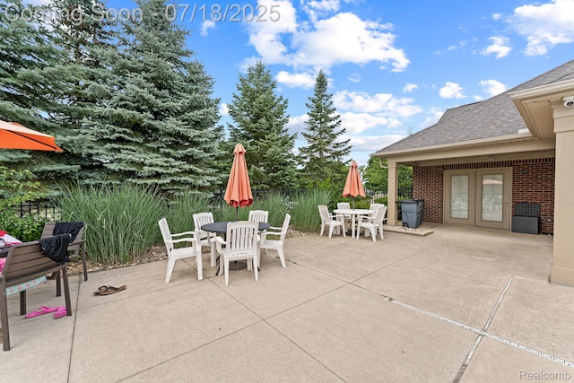 4074 Peach Tree Ln, Howell, MI 48843 - view of patio with outdoor dining area and french doors