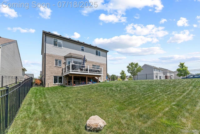 4074 Peach Tree Ln, Howell, MI 48843 - back of house with brick siding, a wooden deck, a fenced backyard, and stairs