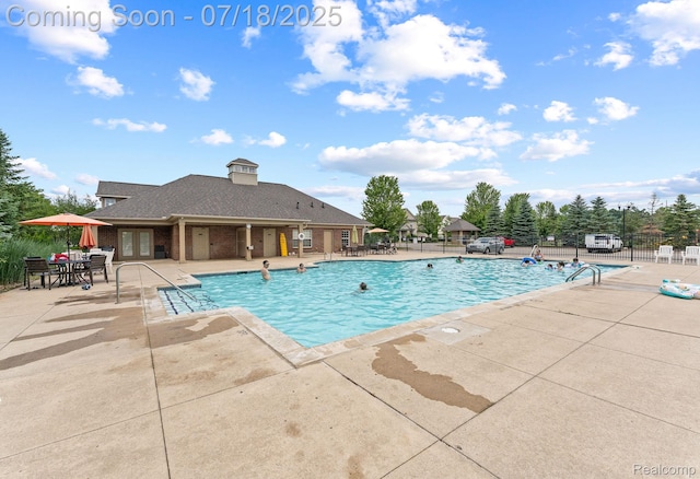 4074 Peach Tree Ln, Howell, MI 48843 - community pool with a patio