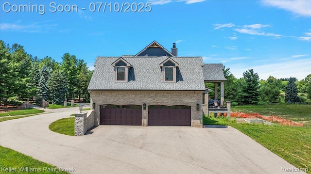 6295 Canter Creek Trl, Grand Blanc, MI 48439 - view of side of home with driveway, an attached garage, a chimney, a shingled roof, and stone siding